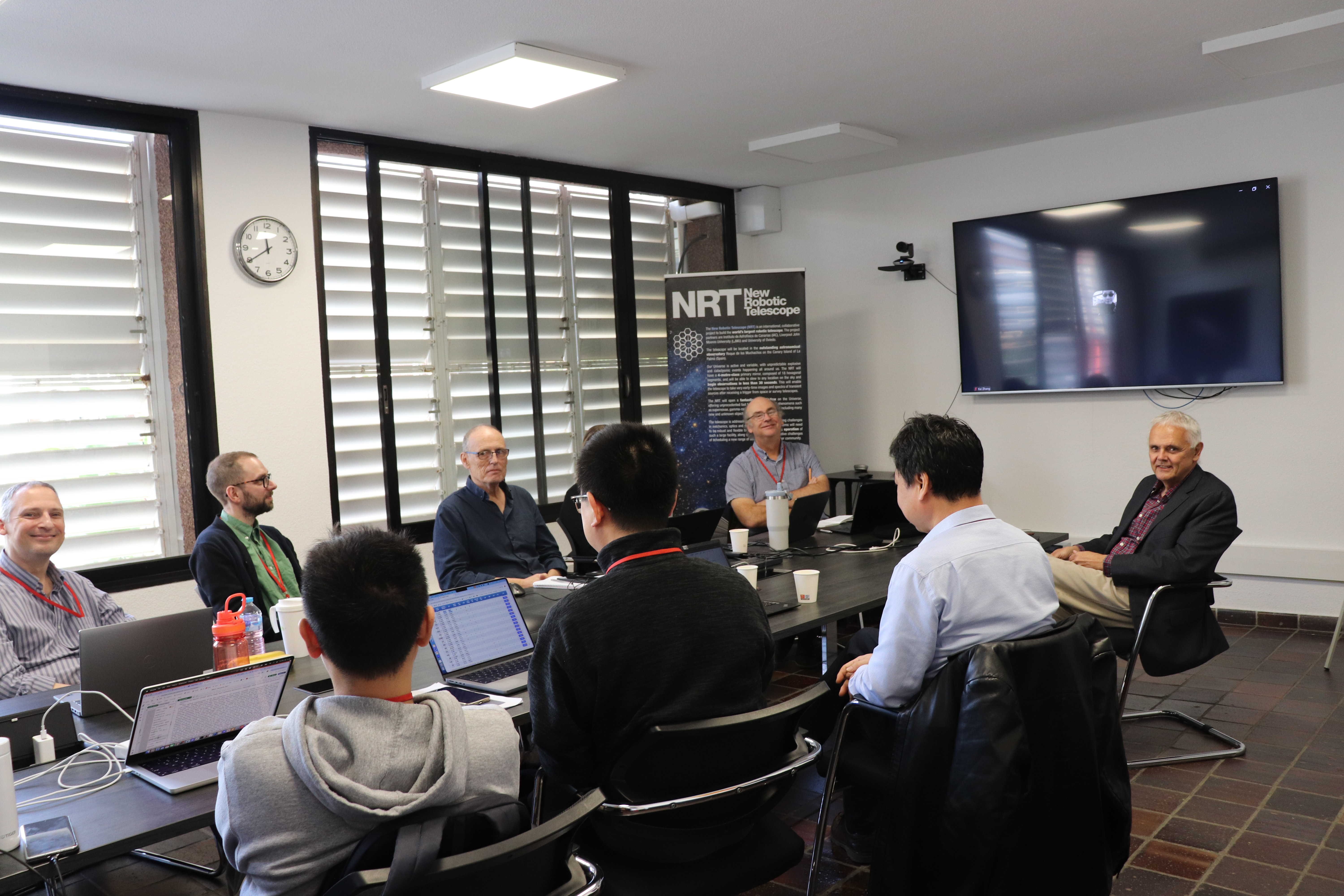 Memebers of NAOC, LJMU and the director of the IAC meeting in a room