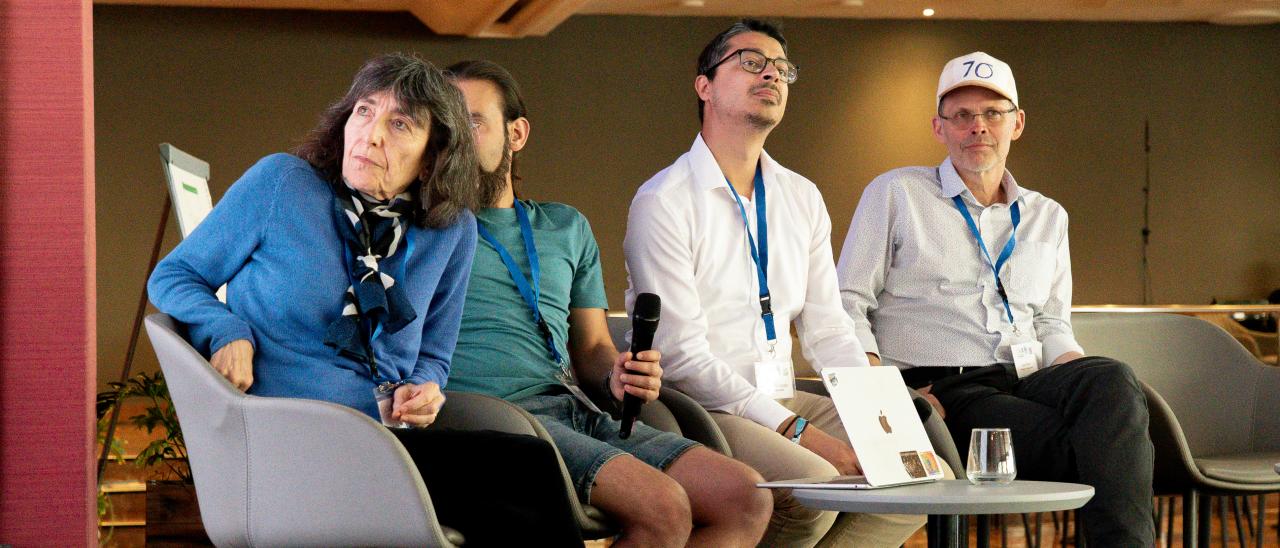 Wendy Freedman, Lloyd Knox, entre otros participantes durante una de las charlas del congreso.