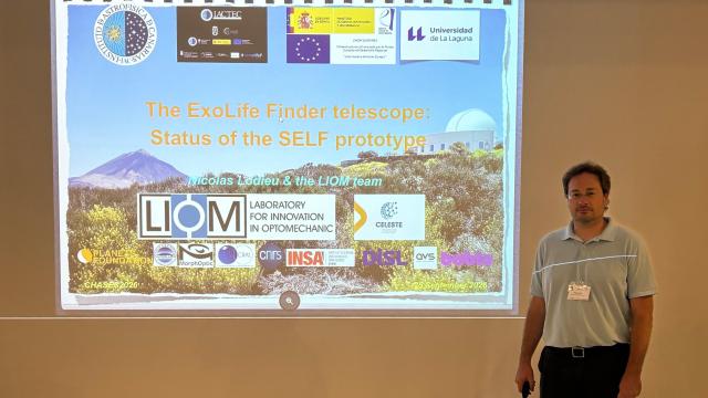 Nicolas Lodieu standing beside the screen during his presentation on the SELF telescope at the CHASES 2026 conference
