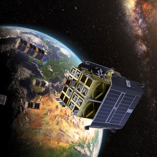 Imagen simulada de una cápsula liberando nanosatélites independientes en el espacio Imagen simulada de una cápsula liberando nanosatélites independientes en el espacio